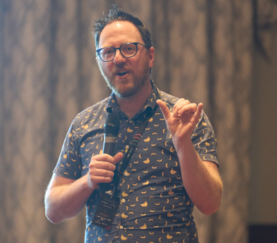 Kevin speaking at a conference